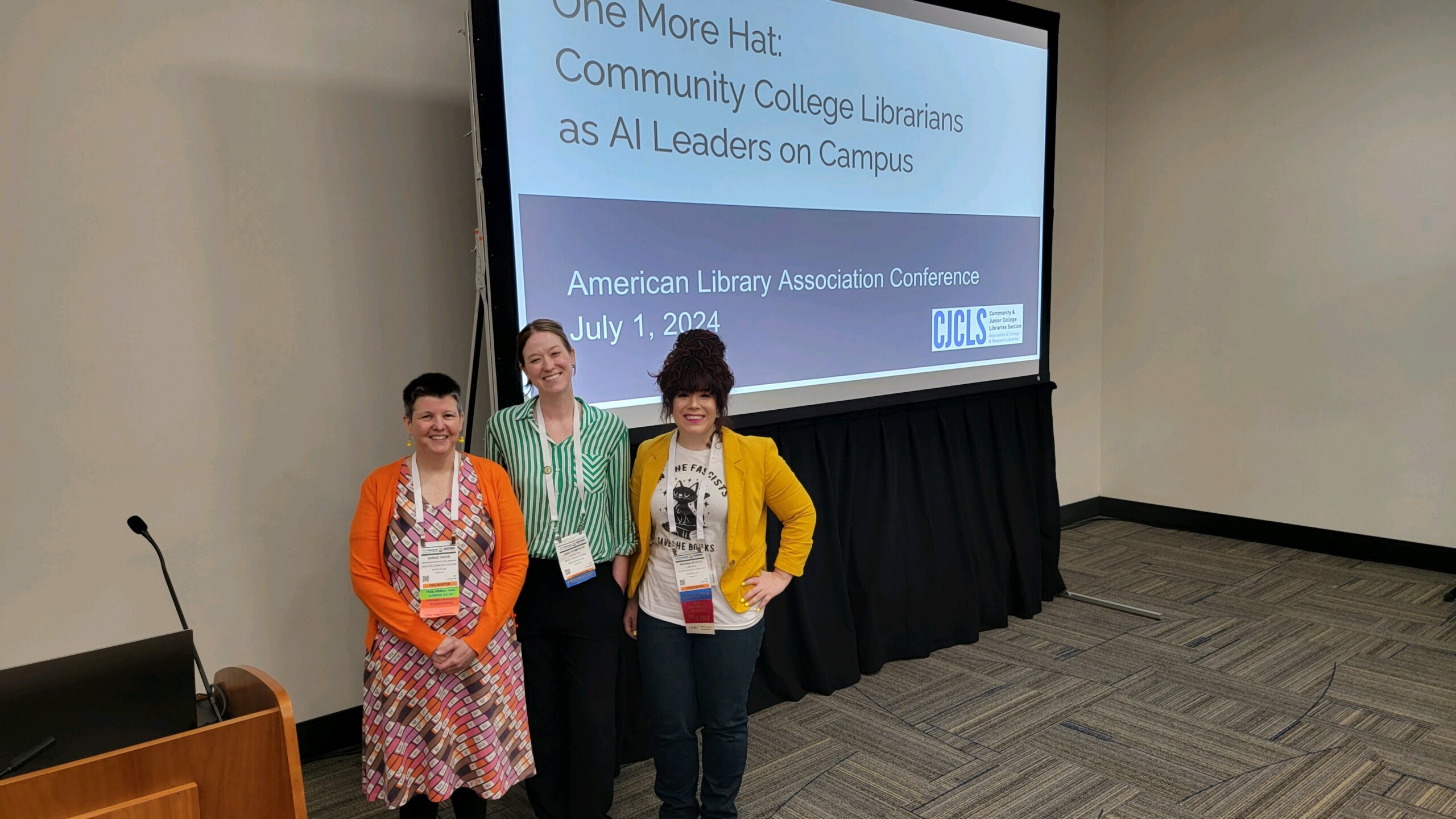 Three people stand in front of a screen with text reading: One More Hat. Community College Libraries as AI Leaders on Campus.