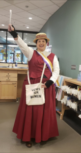 Desiree Smelcer dressed as a suffragist for Hallowen
