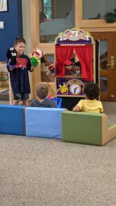 Kids playing with puppets