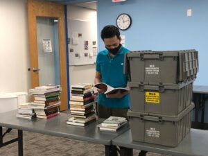 Staff member sorting books