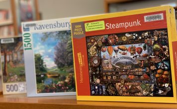 3 boxes of puzzles at Watertown Free Library